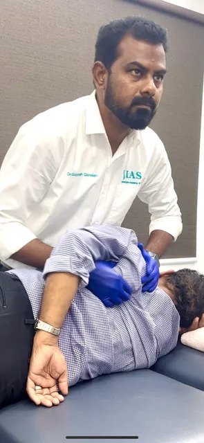 Chiropractic adjustment for shoulder pain at Ishwaryam Spine & Joint Clinic.